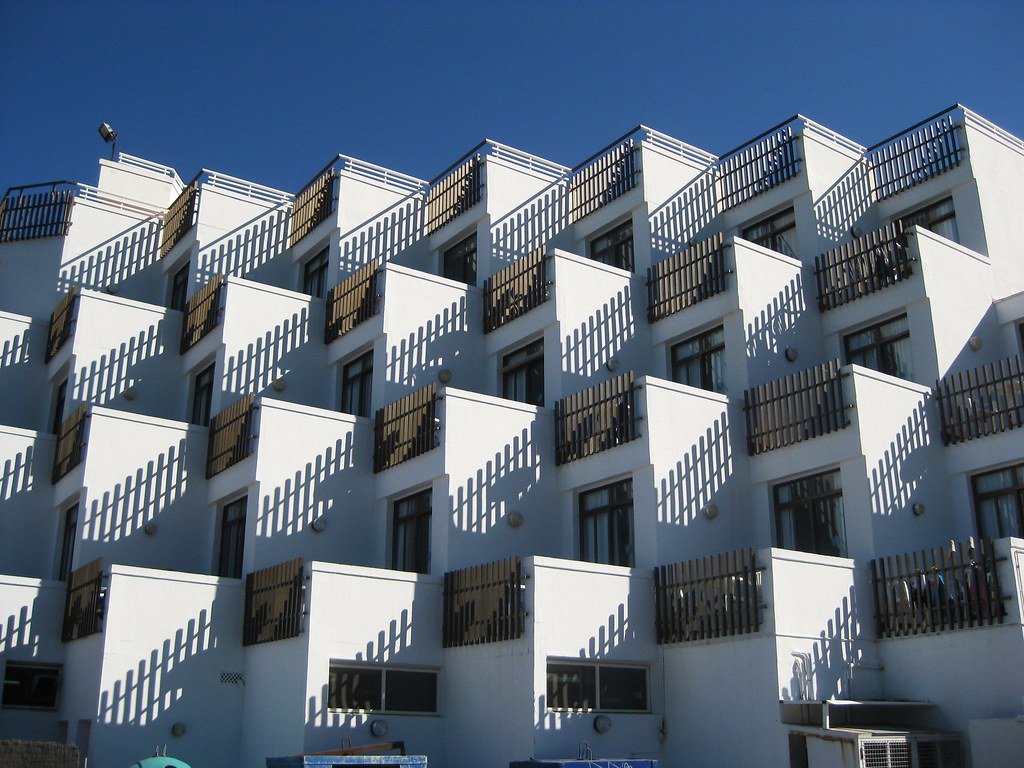 Modernist building facade with angled balconies