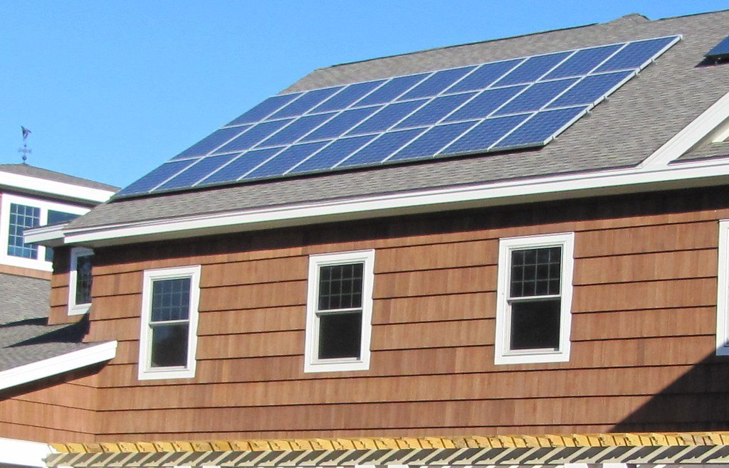 Two storey house with shingle siding