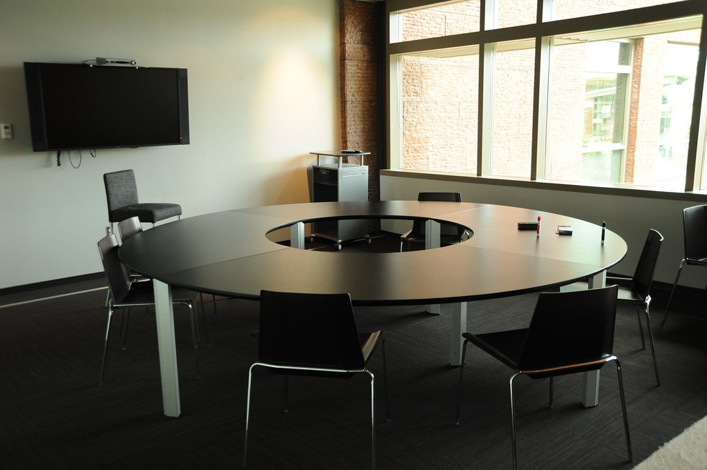 Meeting room with a round table and city view
